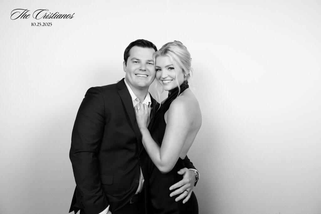 Black and white glam portrait of guests at event with luxury photo booth