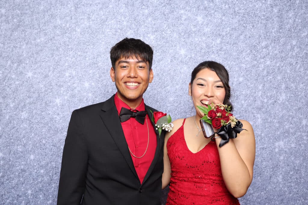 Guests enjoying a fun and festive prom night with friends and decorations.