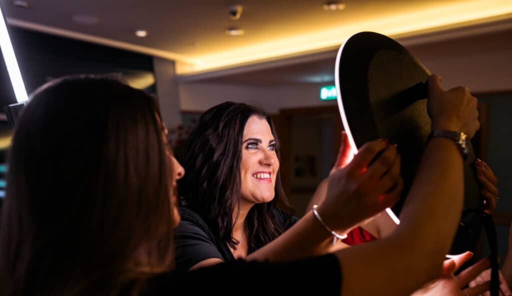 Wedding attendees enjoying a 360 Video Booth, capturing dynamic moments of celebration.