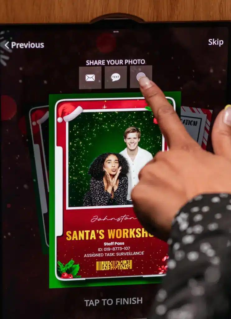 A festive Christmas and holiday-themed event setup with fun photo booth experiences.