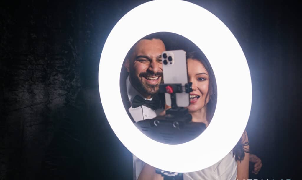 Guests enjoying the Spotlight booth experience, taking memorable event photos.