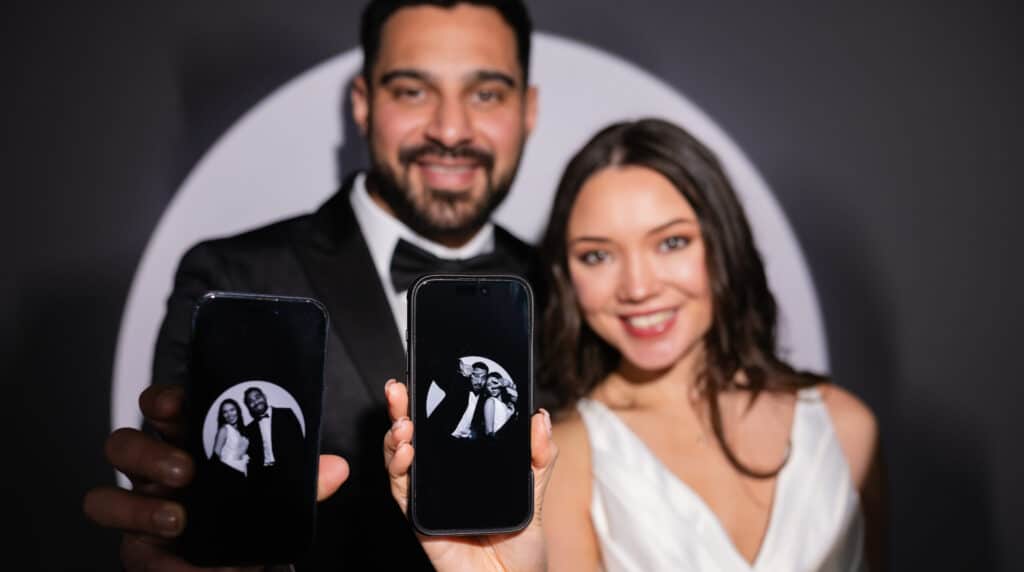 Guests interacting with the Spotlight photo booth, capturing lively and creative photos.
