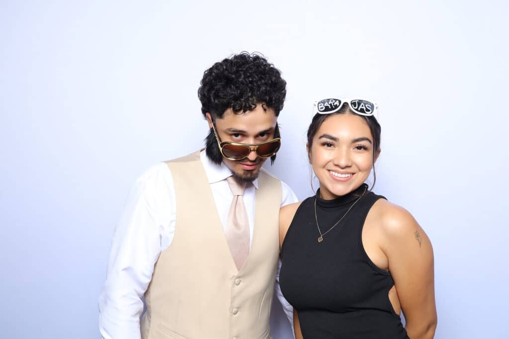 Color glam portrait of wedding guests with luxury photo booth