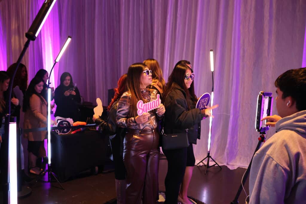 Professionals networking and enjoying activities during a corporate event.