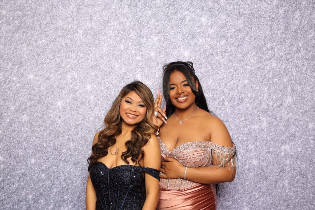 Students celebrating and taking fun photos at a prom event.