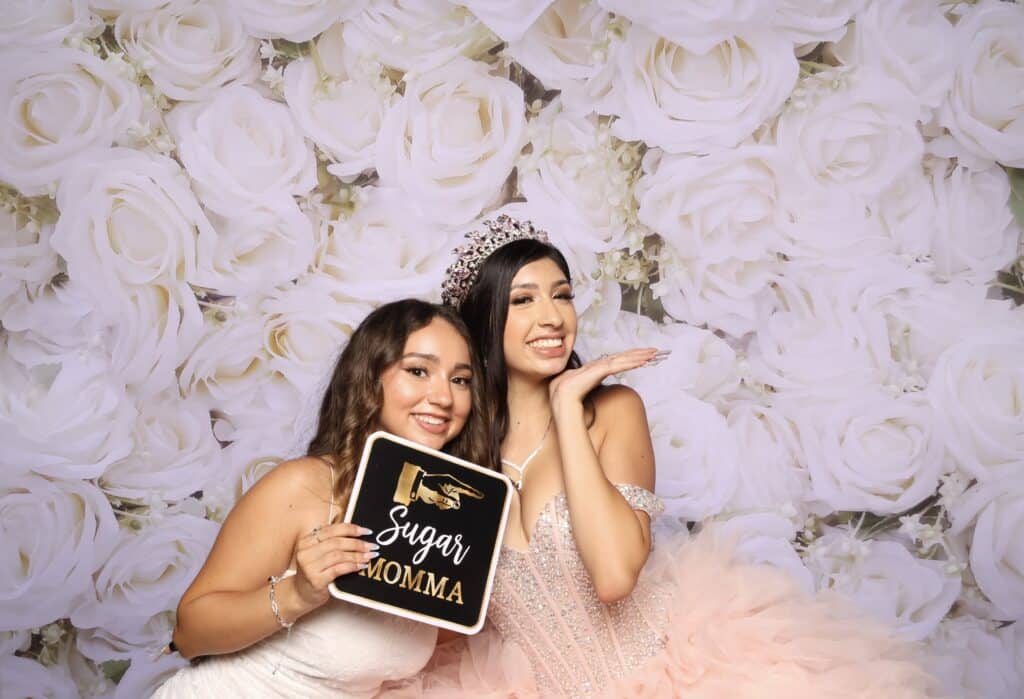 The Quinceañera guest of honor enjoying the celebration with friends and family.
