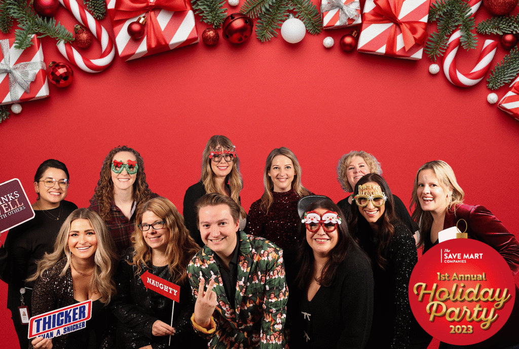 Event attendees celebrating at Save Mart with colorful décor and interactive booths.