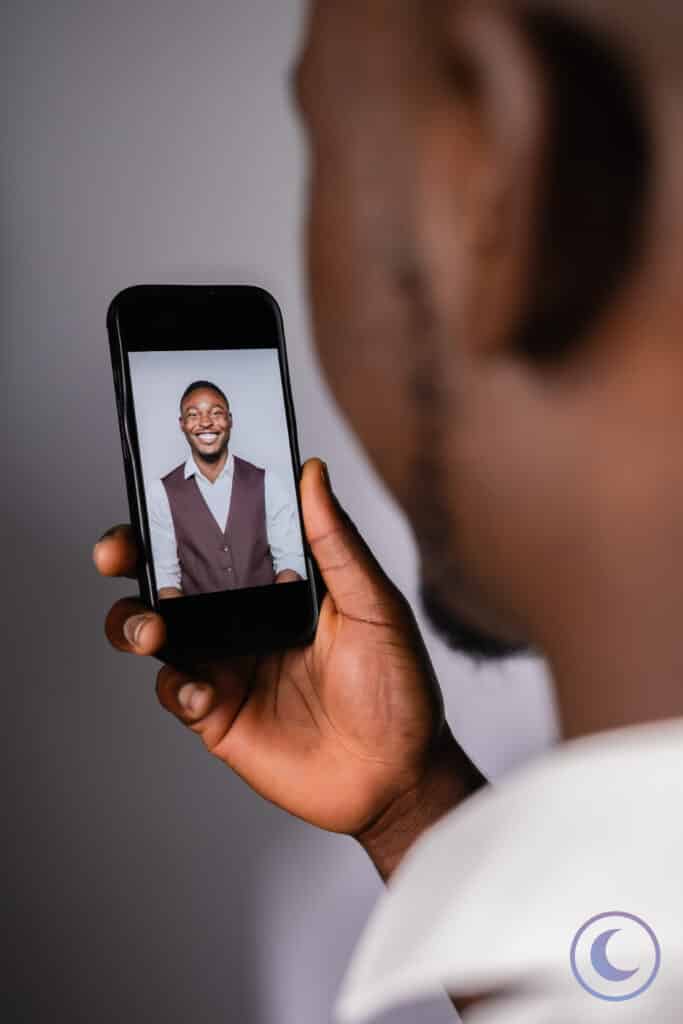 Man viewing his professional headshot on phone from Luna Events Headshot Booth in Modesto CA