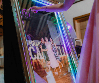 Guests interacting with the Magic Mirror Booth, capturing fun and memorable event photos.