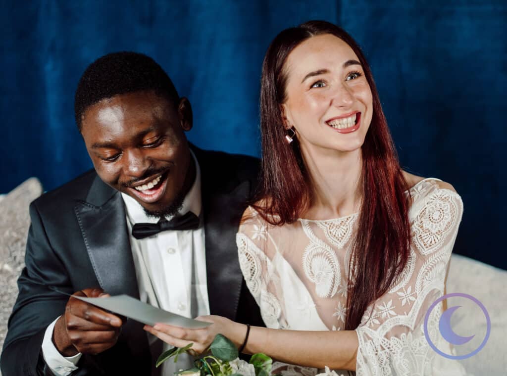 Bride and groom sharing a joyful moment during a wedding portrait studio photography experience