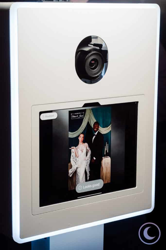On-site wedding portrait studio approval screen showing a bride and groom portrait ready for printing