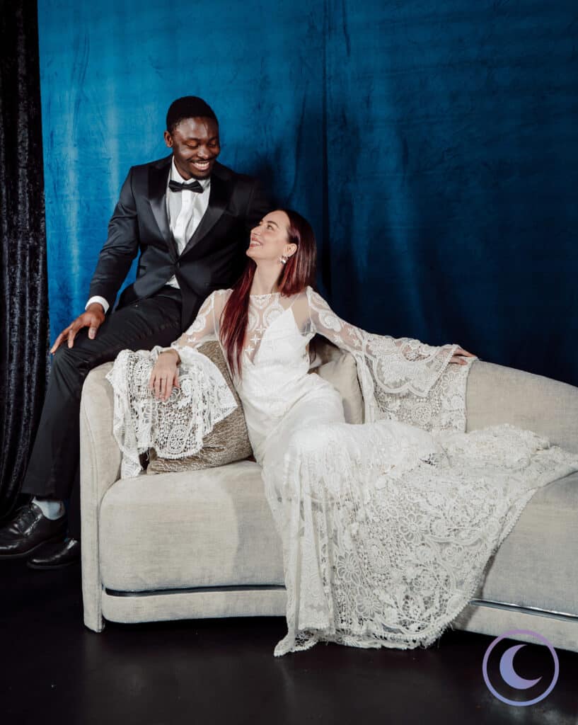 Bride and groom sharing an intimate moment in a luxury wedding portrait studio photography setting